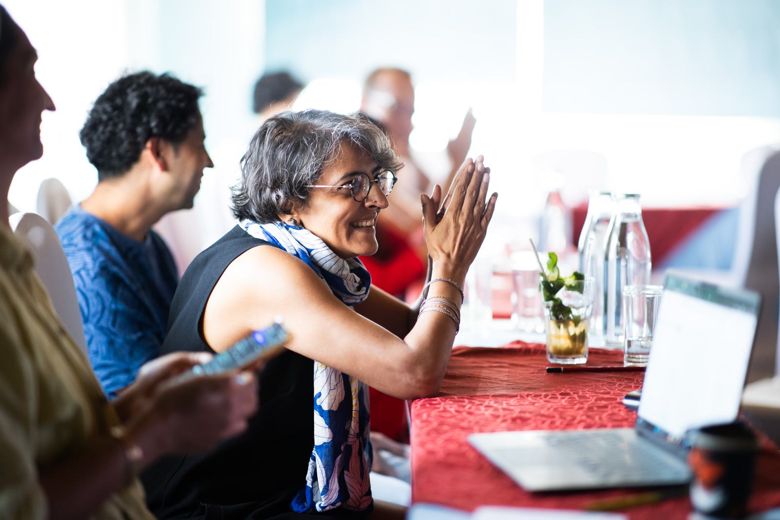 A participant applauds during a 2026 session